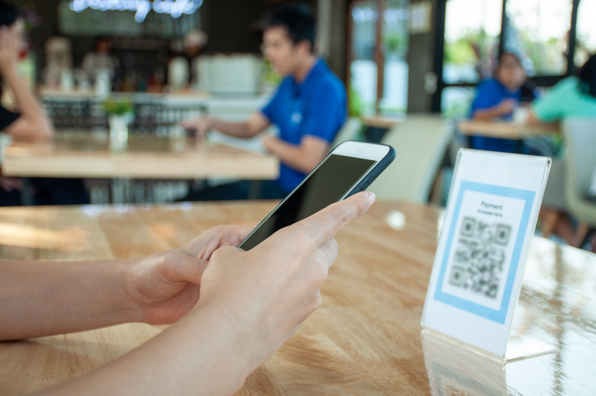 vecteezy woman use smartphone to scan qr code to pay in cafe 17012248